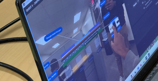 A laptop displays a participant's MR view with component labels during the study.